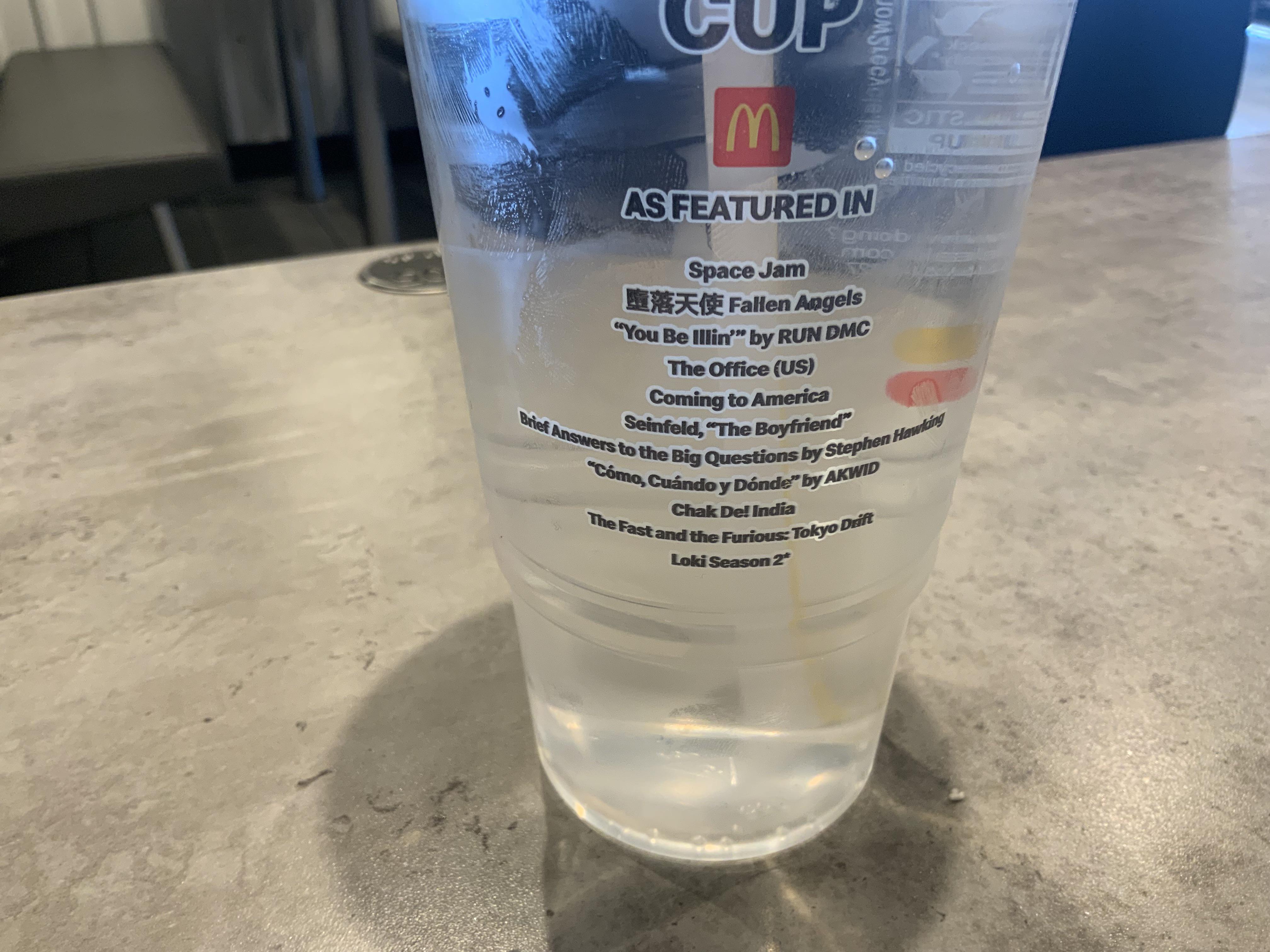 This McDonald's cup has a list of all the movies, shows, and music ...